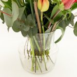 Colorful mixed spring bouquet with glass vase