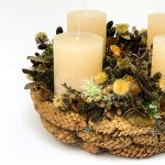 Advent wreath with dried flowers, cream candles