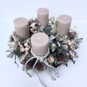 Elegant rose gold advent wreath on a pine cone base